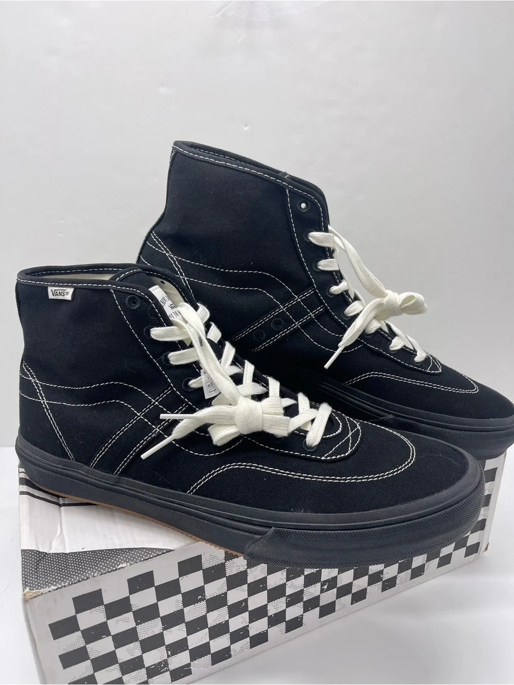Vans Men’s High-Top Canvas Sneakers in Black and White